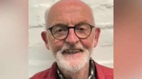 A headshot of David Gair