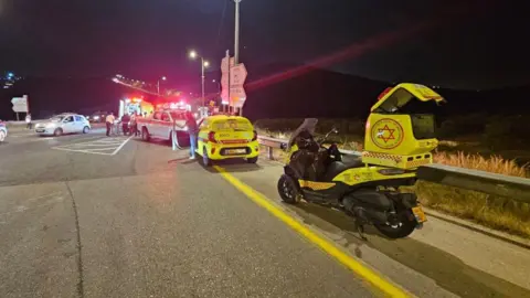 Magen David Adom paramedics at the scene of a shooting attack which killed an Israeli pregnant woman near the settlement of Bruchin, in the occupied West Bank (14 May 2025)