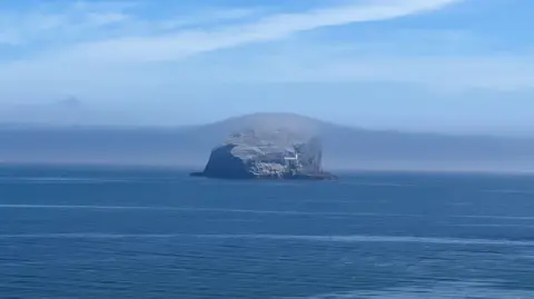 Alasdair Northrop An island with mist starting to settle over it