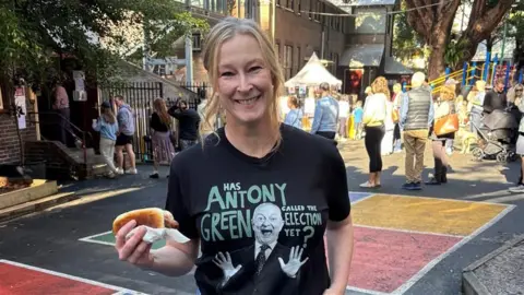 Leigh Selling One of Australia's top presenters Leigh Selling sports an Antony Green t-shirt on election day, while holding a democracy sausage.