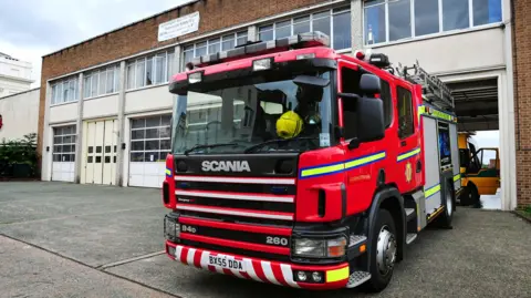 A Scania Fire engine sits outside Leamington Spa Fire Station.