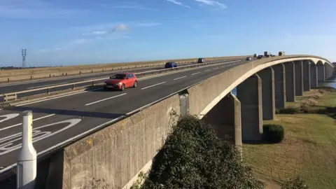 A drone image of the A14 over Orwell Bridge. Vehicles are seen moving along the road in each direction.