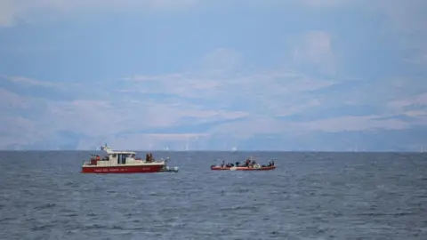 Reuters Two red  boats at sea