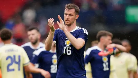 Scotland and Wrexham defender Dom Hyam applauds