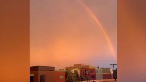 Lightning flash and rainbow over Minnesota