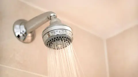 A shower head pouring water