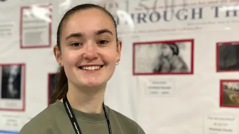 Jon Wright/BBC Lucy has discreet hearing aids in both ears