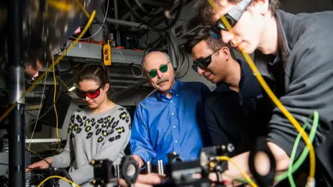 University of Chicago David Awschalom (wearing blue shirt) is the Liew Family Professor of Molecular Engineering and Physics at the University of Chicago's Pritzker School of Molecular Engineering