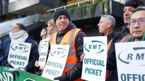 PA Media An RMT picket line outside Euston Station in London during a rail strike in January