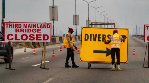 BBC/Ayo Bello A diversion sign on the Third Mainland Bridge, Lagos, Nigeria