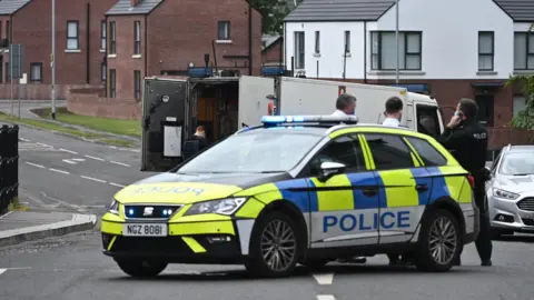 Police attend the scene of Glenavy security alert