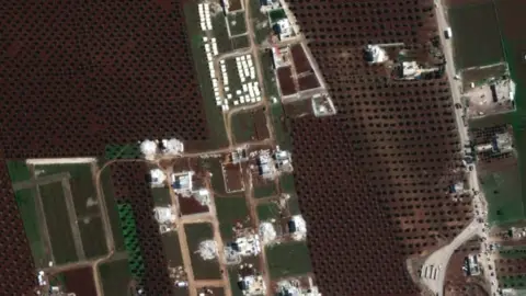 Maxar Satellite image from 11 February 2023 showing flattened buildings and tents in Jindayris, north-western Syria