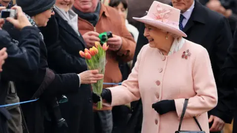 Press Association The Queen receiving flowers from well wishers at West Newton Church near Sandringham, Norfolk