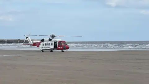 Bridlington Coastguard Rescue Team Coastguard helicopter on beach