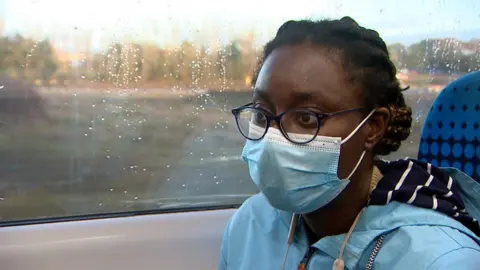Laura Foster/BBC Woman on train