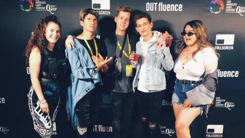 Chris Bruning Chris, pictured in the middle, with friends at VidCon 2019