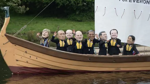 AFP Demonstrators from the 'IF campaign' wearing masks depicting G8 leaders protest against tax avoidance during the G8 Summit in Enniskillen, in Northern Ireland, on June 17, 2013.