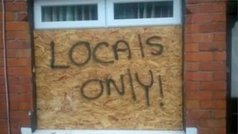 Abuse painted on a window in Cardiff in 2018