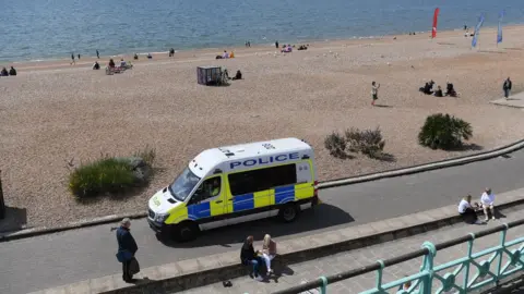 Getty Images A police van on Brighton beach