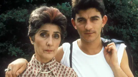 June Brown as Dot Cotton and John Altman as Nick