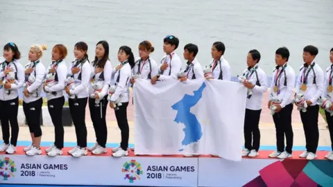 AFP Unified Korea team sing together with unified flag