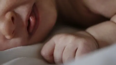 PA Media Newborn baby