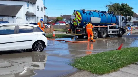 Nigel Sweet A tanker arrives to pump out water