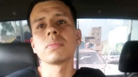 Peruvian Interior Ministry Alexander Delgado in a police car in custody