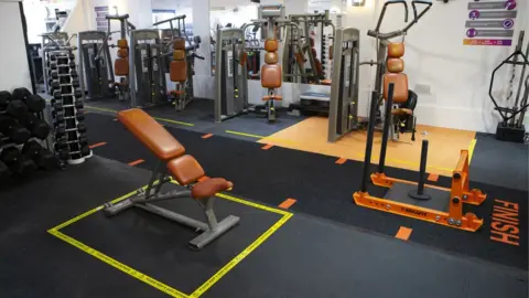 Getty Images Oasis Gym in Stanford Le Hope prepares to reopen by installing social distancing signs