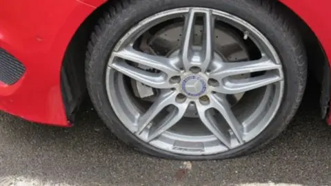 Dr Ken Addison One of the burst tyres Dr Ken Addison was left with