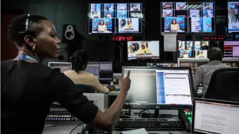 Reuters Staff work in a control during a news program at NTV studios in Nairobi on February 6, 2018. The Government disconnected three major Kenyan television channels, NTV, KTN News and Citizen TV, during their live coverage of Raila Odinga as he swore himself in on January 30, 2018, as "people"s president," despite losing in flawed elections last year. NTV and KTN News resumed broadcasts yesterday but Citizen TV remains to broadcast on internet only.