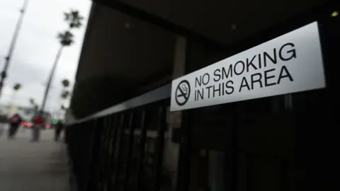 Getty Images A 'No Smoking' sign is seen outside of a business on Wilshire Boulevard on May 10, 2019 in Beverly Hills, California