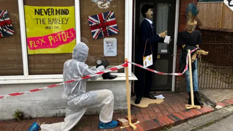 Scarecrows depicting a crime scene