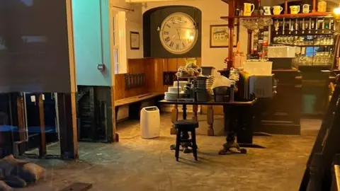 Laura Robinson Damaged floor inside a pub