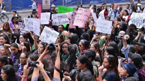 Getty Images Several feminist demonstrators take part in a protest against gender-based violence against women after the murder of Ingrid Escamilla, 25, stabbed to death and then skinned by her partner in the north of Mexico City at Reforma Avenue in Mexico City, Mexico