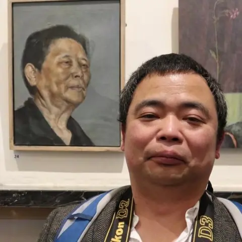 George McBean Li Huang with painting