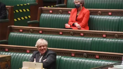 PA Media Theresa May