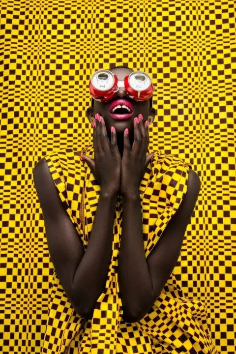 Thandiwe Muriu Woman with Coke cans as eyewear