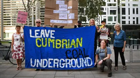 EPA Protestors with banners in London