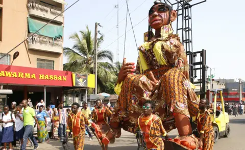 EPA Participants pull a giant puppet during the opening parade for the Market for African Performing Arts (Masa) in Abidjan, Ivory Coast - Friday 4 March 2022