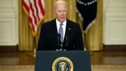 Getty Images Joe Biden gives an update on his administration's COVID-19 response and vaccination program in the East Room of the White House