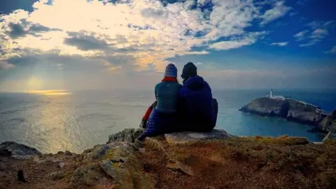 Kelly Jones A couple admire the view at South Stack, Anglesey