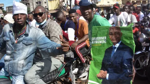 AFP Supporters of Cellou Dalein Diallo on motorbikes in Guinea