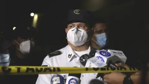 EPA The Director of the National Civil Police of El Salvador Mauricio Arriaza Chicas speaks to the press in the area where six people were killed, in San Salvador, El Salvador, 11 October 2020.