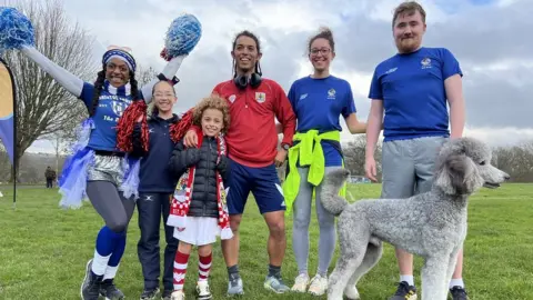 Cheryl Dennis/ BBC Competitors at the joint Bristol Rovers and Bristol City at Blaise Castle smile at the camera