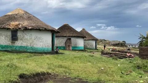 A row of mud huts in Xolobeni, Eastern Cape
