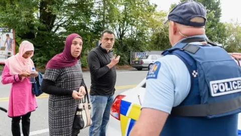 Getty Images Police talking to relatives