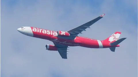 Getty Images AirAsia plane flying in Malaysia