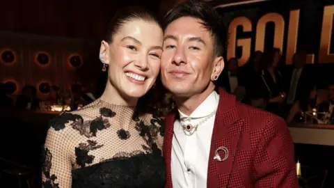 Getty ImagesRosamund Pike and Barry Keoghan