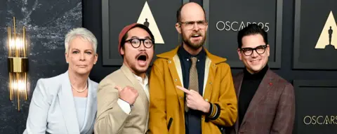 Getty Images Jamie Lee Curtis, Daniel Kwan, Daniel Scheinert, and Jonathan Wang